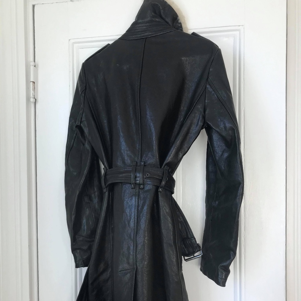 A coat, a jacket, 2 rain coats, a dress
